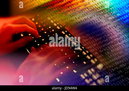 Hacker writing malicious code for an attack on the internet. Stock Photo