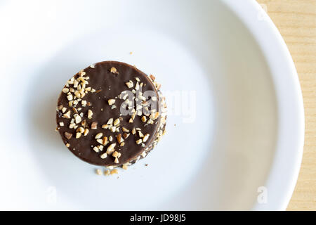 Argentina's cookie 'alfajor', chocolate coated sandwich cookie filled with caramel and almond Stock Photo