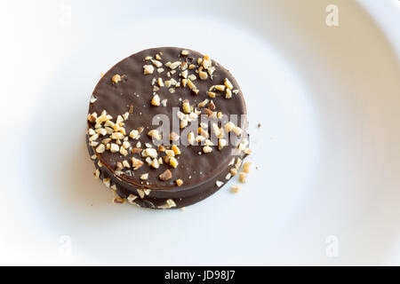 Argentina's cookie 'alfajor', chocolate coated sandwich cookie filled with caramel and almond Stock Photo