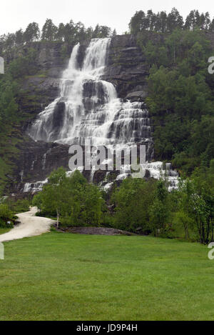Tvindefossen (also written Tvinnefossen; also called Trollafossen) is a waterfall near Voss, Norway. It is 12 km from Voss on the road to Flåm. Stock Photo