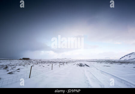 Cosy log cabin in snow covered landscape, distant, Iceland, Europe. Iceland nature 2017 winter cold Stock Photo