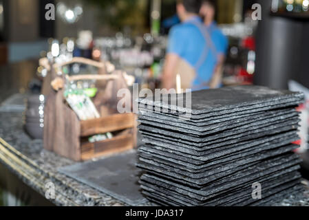 Black graphite sushi slate boards at restaurant Stock Photo