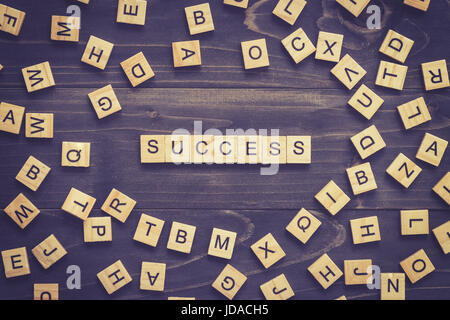 Success word on wood table for business concept. Stock Photo