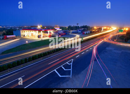 Blurred motion of car lights on highway at night. Stock Photo