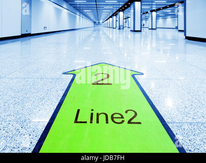 Directional sign in the subway near the door gate. Stock Photo