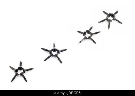 Five-pointed stars lined diagonally with Oxidized self-tapping screw isolated on white background Stock Photo