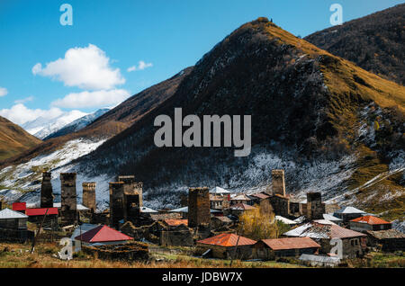 Svan Towers in Chazhashi village in Ushguli commune at the foot of the mountain with Tamar's Castle on top. Autumn. Caucasus, Upper Svaneti, Georgia.  Stock Photo