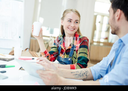 Couple of creative designers discussing new project Stock Photo