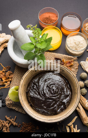 Indian Ayurvedic dietary supplement called Chyawanprash / chyavanaprasha is a cooked mixture of sugar, honey, ghee, Indian Gooseberry (amla), jam, ses Stock Photo