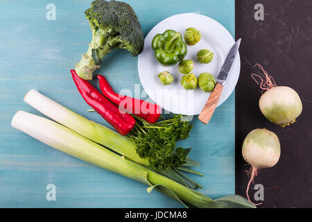 different fresh seasonal vegetables on wooden table background Stock Photo