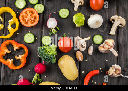 Close-up top view of fresh vegetables on rustic wooden table Stock Photo