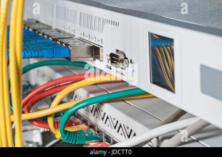 Rack with routers with an empty serial console close-up Stock Photo