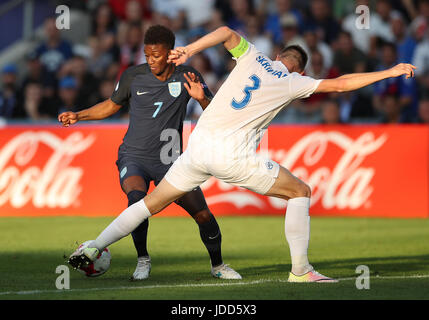 Slovakia's Milan Skriniar and England's Demarai Gray (left) battle for the ball during the UEFA European Under-21 Championship, Group A match at the Kolporter Arena, Kielce. Stock Photo