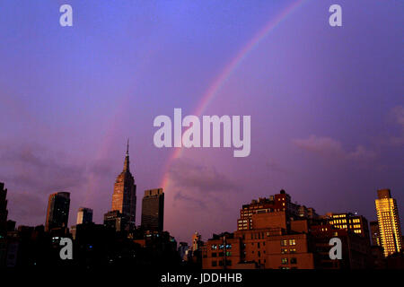 New York, United States. 19th June, 2017. A double rainbow over Manhattan's Empire State Building in New York following a thunderstorm in the city Monday afternoon, June 19th, 2017 Credit: Adam Stoltman/Alamy Live News Stock Photo