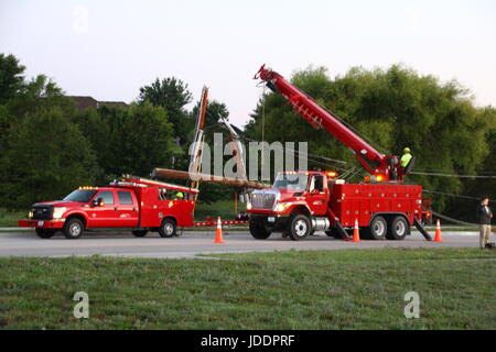 Colombia, Minnesota, USA. 20th June, 2017. Columbia Water and Light work to replace a sleeping driver's damage Credit: Redd Roberts/Alamy Live News Stock Photo