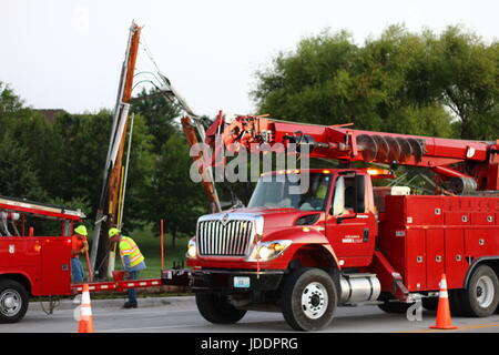 Colombia, Minnesota, USA. 20th June, 2017. Columbia Water and Light work to replace a sleeping driver's damage Credit: Redd Roberts/Alamy Live News Stock Photo