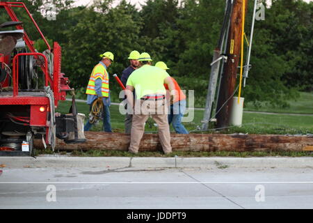 Colombia, Minnesota, USA. 20th June, 2017. Columbia Water and Light work to replace a sleeping driver's damage Credit: Redd Roberts/Alamy Live News Stock Photo