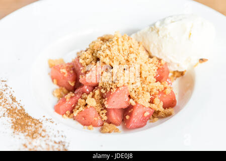 apple crumble with Icecream and cinnamon powder Stock Photo