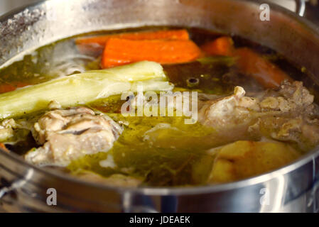 Preparation of chicken soup with vegetables. Polish cuisine. Stock Photo