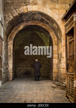 old man walking in the street Stock Photo