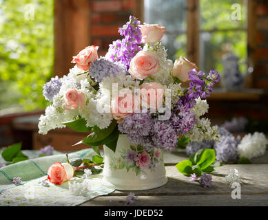 Bouquet of flowers with roses and lilacs. Stock Photo