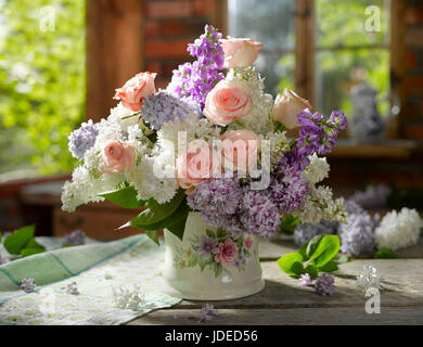 Bouquet of flowers with roses and lilacs. Stock Photo