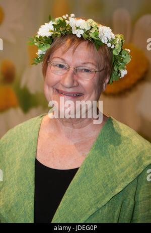 TARJA HALONEN former Finish president with flower ring on the head 2017 Stock Photo