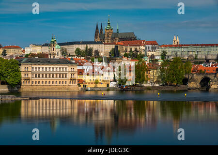 View of Mala Strana district with St. Vitus cathedral reflected in the Vltava River, Prague, Bohemia, Czech Republic Stock Photo