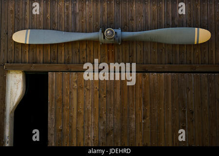 Vintage propeller hangs on a wall Stock Photo