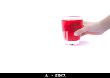 Hand holding a glass of syrup water isolated on white background Stock Photo