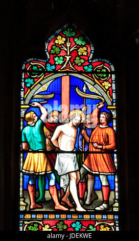Story of Easter, Flagellation, Scourging of Jesus, stained glass window by William Warrington, 1854, Gunthorpe, Norfolk, England, UK Stock Photo