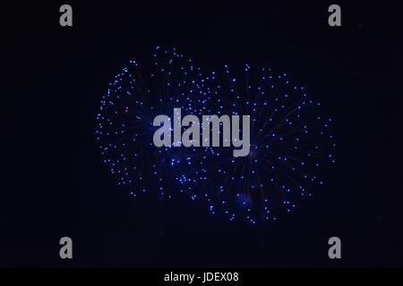 Blue  fireworks in the black night sky Stock Photo