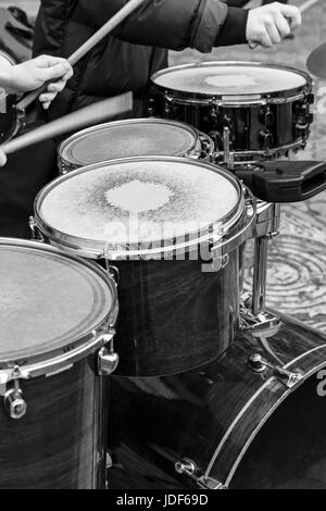 street musicians playing drums with a drumsticks in his hands Stock Photo