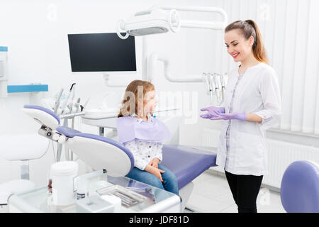 Dentist and small girl in cabinet Stock Photo