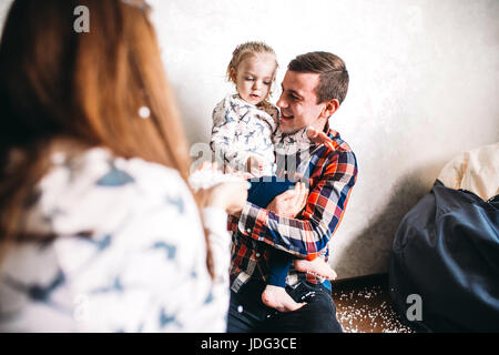 Happy family playing together on the floor Stock Photo
