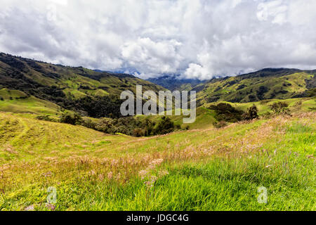 Dramatic clouds over pastures in a valley outside of Salento, Colombia. Stock Photo