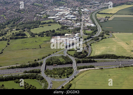A plane flying over the M1 motorway in Leicestershire UK to land at ...