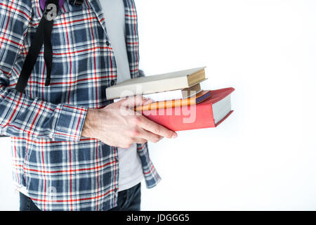 mid section of student holding books isolated on white with copy space Stock Photo