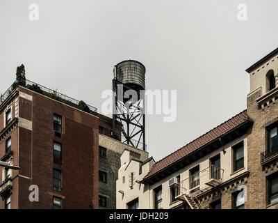 New York city rooftop water tower tank Stock Photo