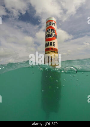 Split shot half and half with Minimum Wake Buoy - Anna Maria Island, Florida, USA Stock Photo