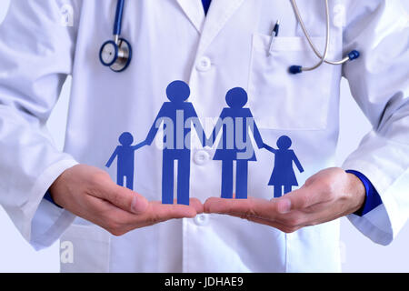 Caucasian general doctor taking family cut. Concept of family health insurance.. Horizontal composition. Stock Photo