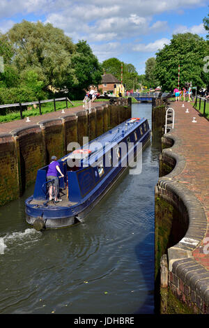 Narrowboat leaving Aldermaston Lock going down river on the Kennet and Avon Canal near Aldermaston and Theale, West Berkshire, UK Stock Photo