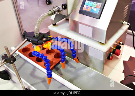 Small automated bread production line in bakery Stock Photo