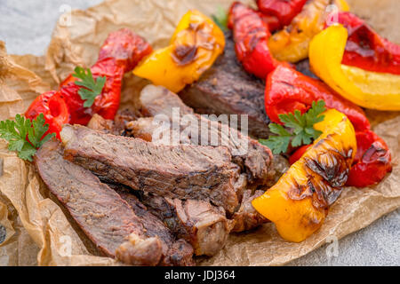 Beef Fajitas with colorful bell peppers on a table Stock Photo