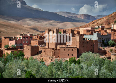 village Ait Ouglif with clay casbahs in Dades valley with mountains of High Atlas behind, Morocco, Africa Stock Photo