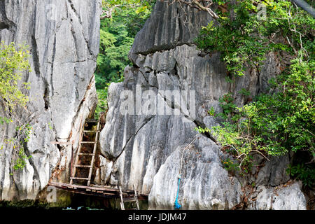 blur in philippines view from a boat of  palm cliff beach and rock from pacific ocean Stock Photo