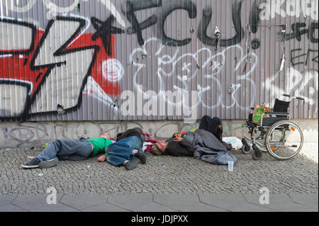 29.05.2017, Berlin, Germany, Europe - A group of East European men is sleeping off their hangover near the Alexanderplatz in Berlin. Stock Photo
