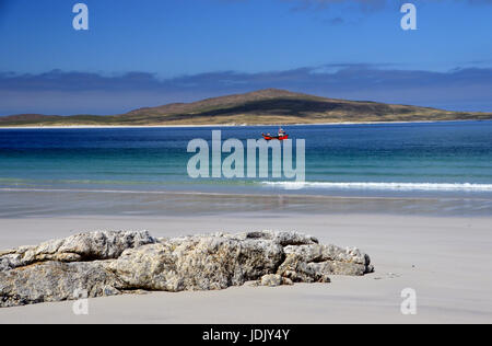 A Small Red Fishing Boat Passing West Beach on the Island of Berneray on North Uist with the Island of Pabbay in the Background, Outer Hebrides, Stock Photo
