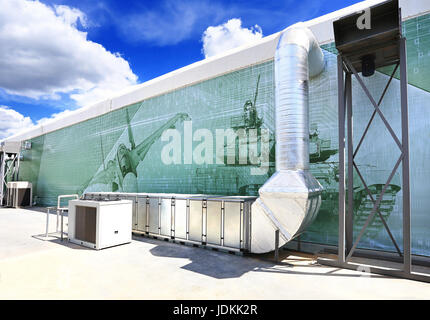 Ventilation pipes and actuators on the wall of an exhibition pavilion Stock Photo
