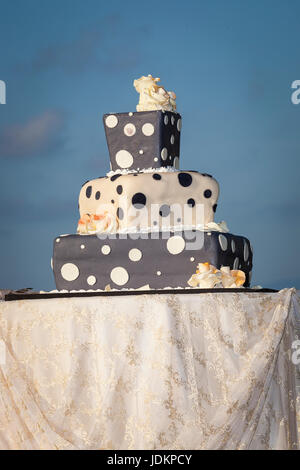 three tiered polka dot wedding cake covered with sugar paste Stock Photo